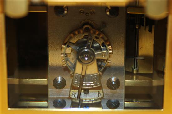 An Edwardian ormolu hour repeating carriage clock, 7in., with original travelling case